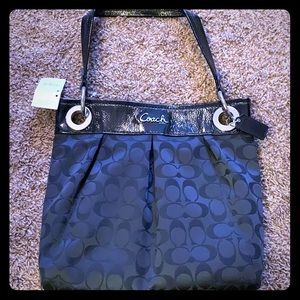 Medium size black Coach purse